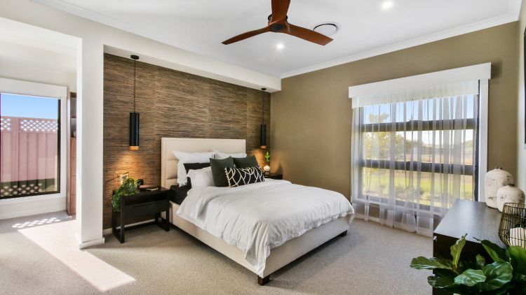 neutral tones and feature wall in master bedroom
